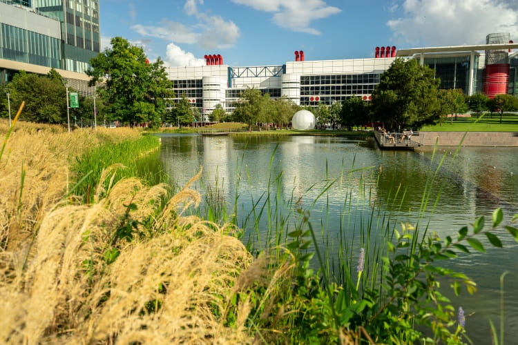 an exterior shot of the george r. brown convention center in houston